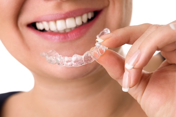 patient-with-invisalign-aligner