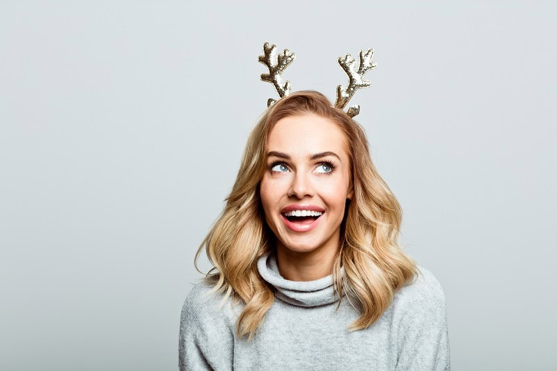 Woman smiling during 2020 holidays