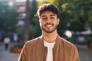 Young,Hispanic,Man,Smiling,Confident,Standing,At,Park