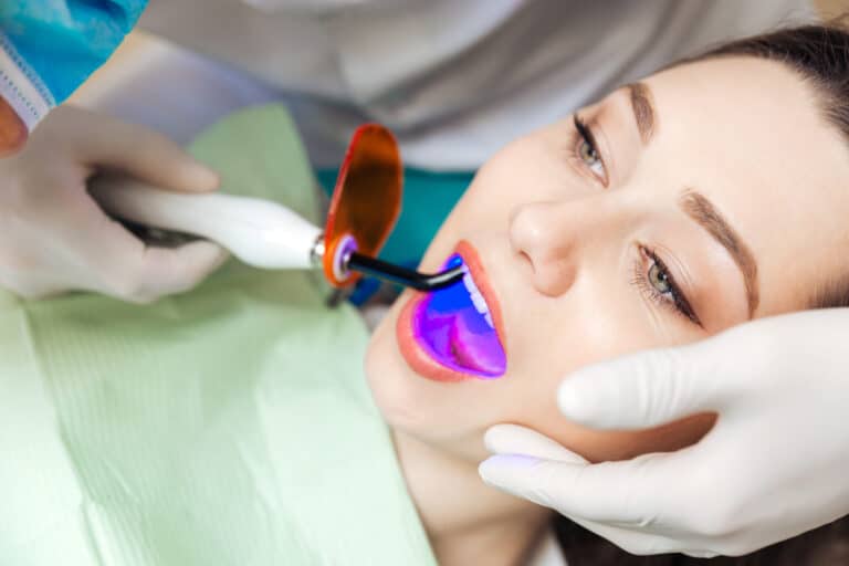 Close up,Portrait,Of,A,Female,Patient,Getting,A,Bleach,Treatment